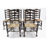 A set of six early 19th century beech rush-seat dining chairs, including a pair of carvers, with