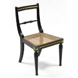 A late regency ebonised & brass-mounted cane-seat occasional chair, the bow-back with turned