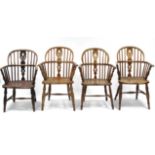 A matched set of four ash & elm Windsor elbow chairs with pierced splats to the hopped spindle