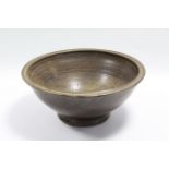 A large studio pottery stoneware deep bowl by George Owen Jones (1916-1997), of olive-green glaze;
