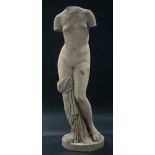 A reconstituted stone classical female nude figure, on flat circular base; 34¾” high.