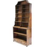 A REGENCY MAHOGANY TALL STANDING OPEN BOOKCASE of eight tiers, the upper part graduated, fitted