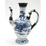 A Kang Hsi period Chinese blue & white porcelain ewer, the ovoid body painted with a phoenix to