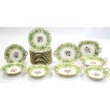 A mid-19th century English porcelain dessert service, the cream borders with green & gilt vine