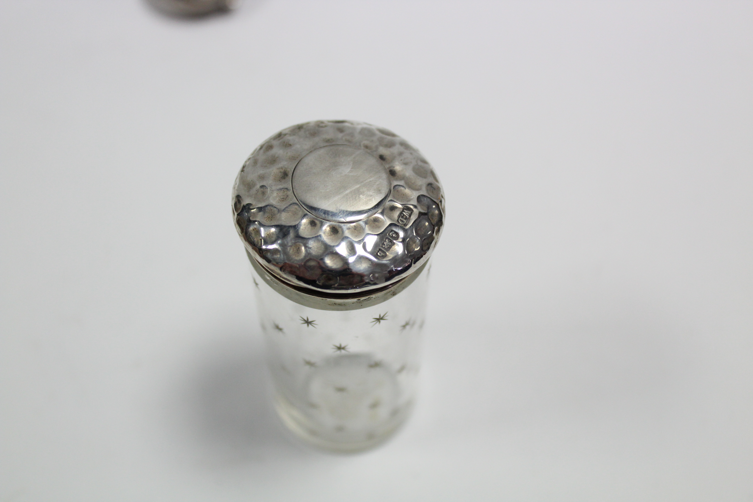 An Edwardian circular pill box with embossed hinged lid, Birmingham 1902; & four cut glass - Image 3 of 4