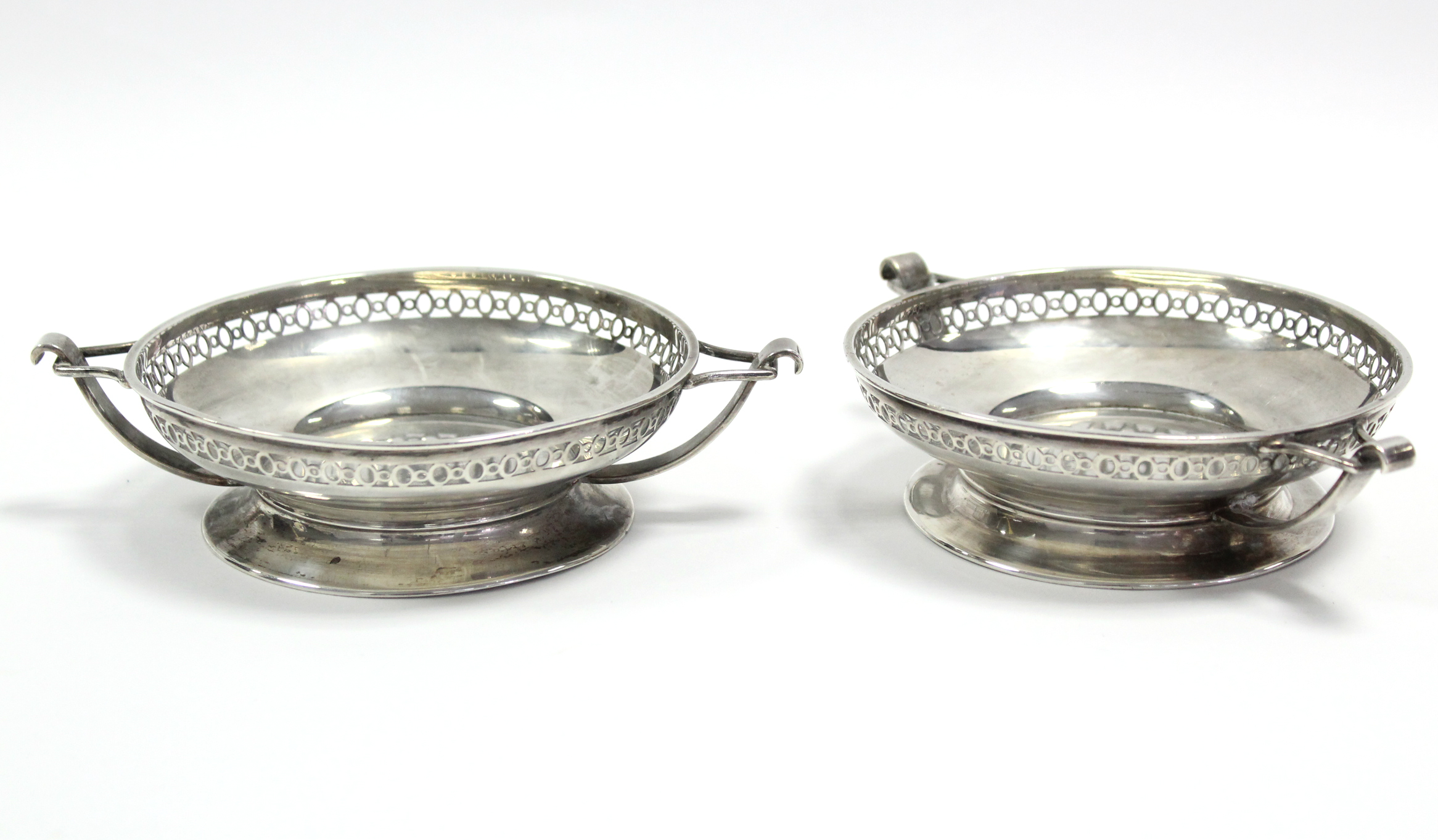 A pair of George V circular shallow two-handled sweetmeat dishes, each with pierced rim & on