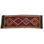 A Suzni Kelim runner with all-over brightly coloured geometric design; 28" x 86".