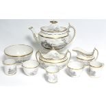 An early 19th century Spode porcelain part tea service with bat-printed landscapes & gilt rims,