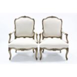 A PAIR OF LOUIS XVI-style open armchairs, the padded shaped backs, seats & arms upholstered calico