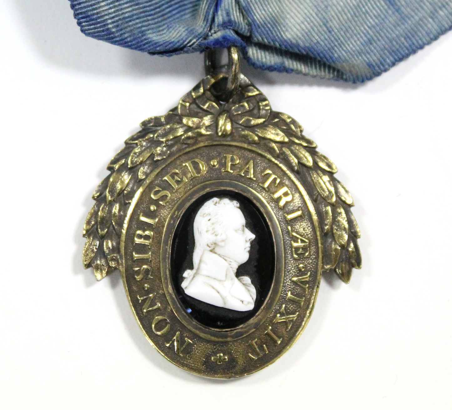 A 19th century London Pitt Club member’s badge, the silver-gilt oval medal inset “Tassie” glass