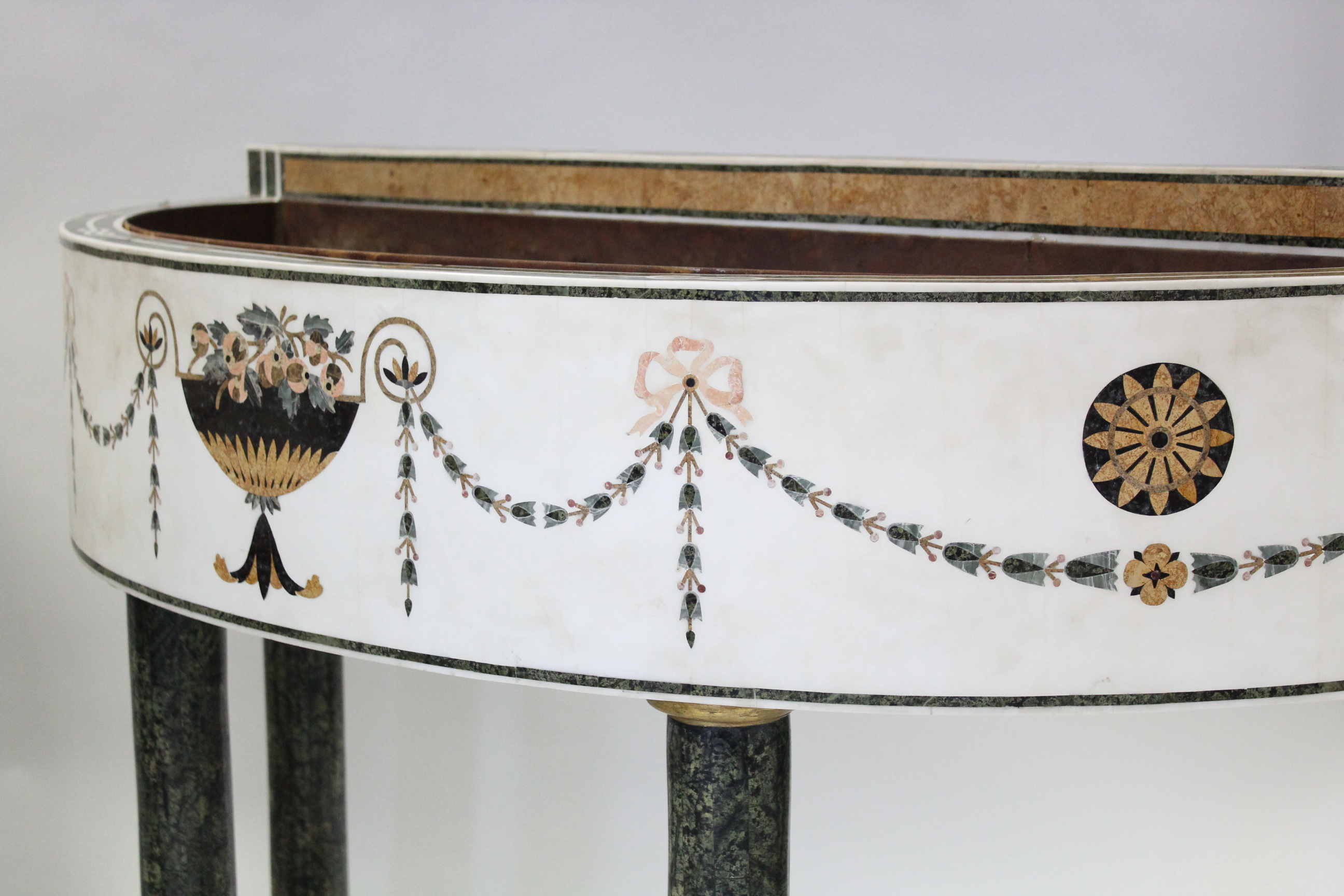 A PAIR OF WHITE MARBLE & PIETRA DURA JARDINIÈRE TABLES, each of demi-lune shape, decorated with husk - Image 5 of 8