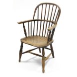 A 19th century ash & elm Windsor elbow chair with hoop back, turned arm supports & legs with H-