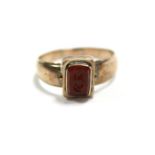 An antique gold signet ring with double-sided rectangular swivel seal matrix set bloodstone &