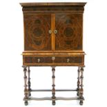 A WILLIAM & MARY OYSTER-VENEERED LABURNUM CABINET ON STAND fitted long cushion drawer to the frieze,