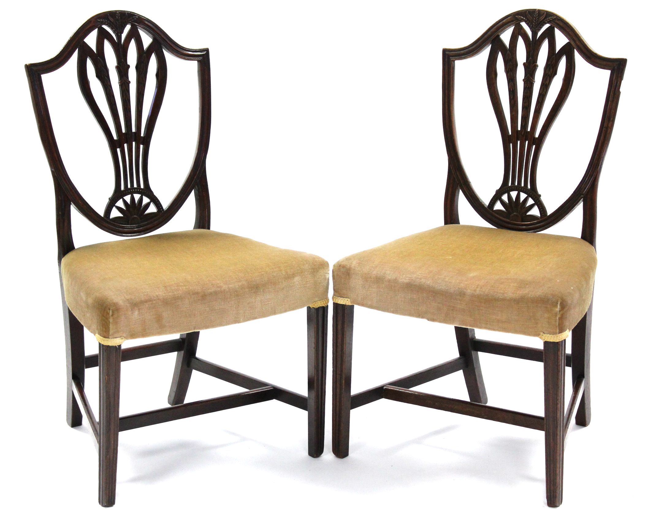 A pair of 18th century mahogany Hepplewhite-style dining chairs, the shield-shaped backs with