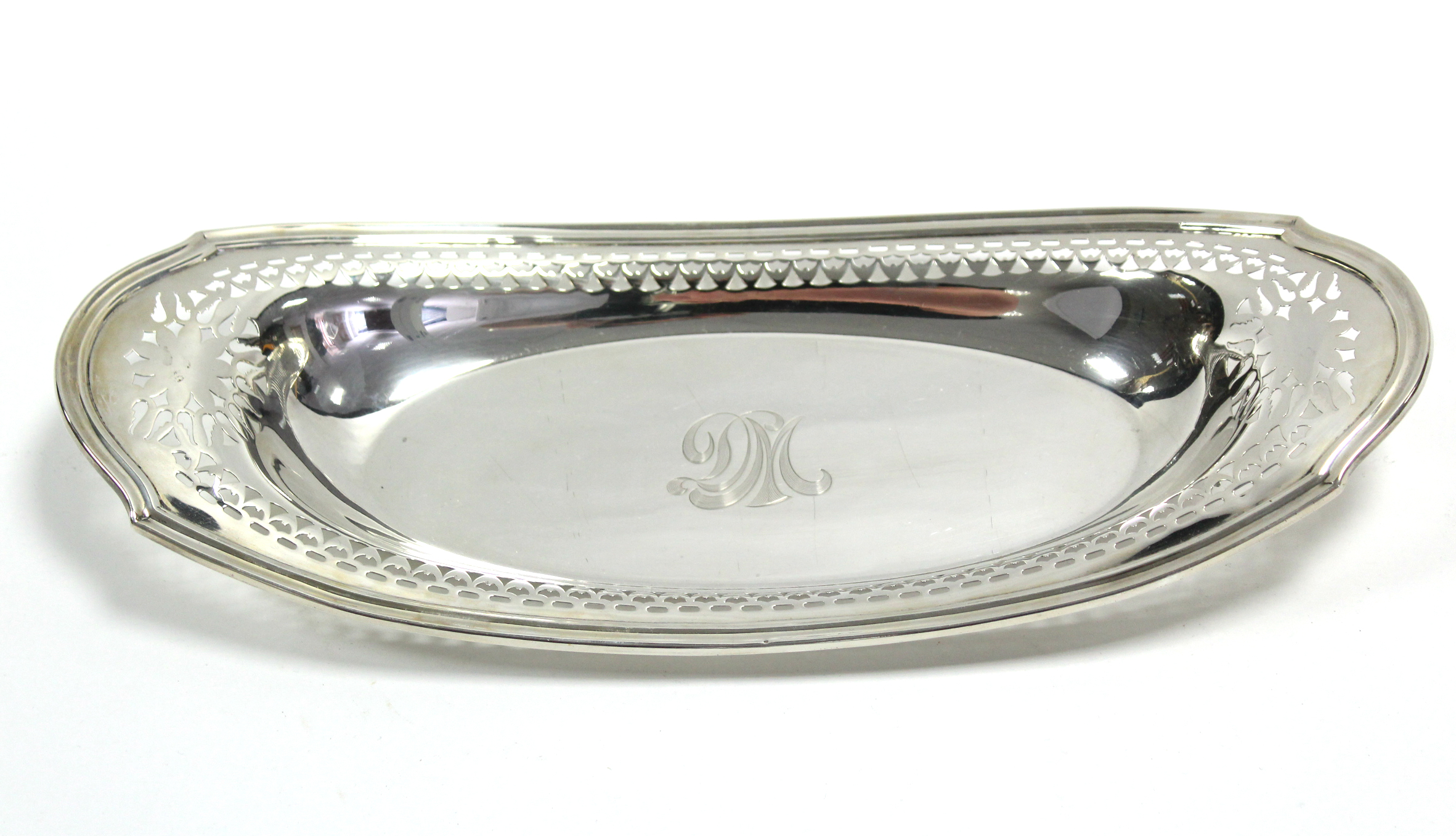 A Sterling oval shallow dish with moulded rim & pierced border; 14” x 6”. (11 oz).