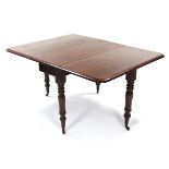 A William IV mahogany drop-leaf dining table, the rectangular top with rounded corners, on turned