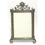 A 19th century rectangular cast brass picture frame with foliate border & pierced crest, on easel