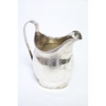 A George III upright ovoid milk jug with engraved decorative bands, reeded rim, & loop handle, 4¼”