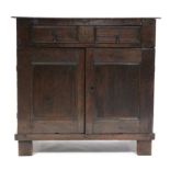 AN EARLY 18th century OAK CHEST, fitted long frieze drawer above a pair of panel doors enclosing