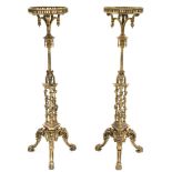 A PAIR OF CHIPPENDALE-STYLE CARVED GILTWOOD TORCHERES, each with pierced gallery supported by