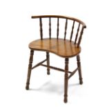 An ash & elm child's chair with kidney-shaped seat, rounded spindle-back, & on turned legs with H-