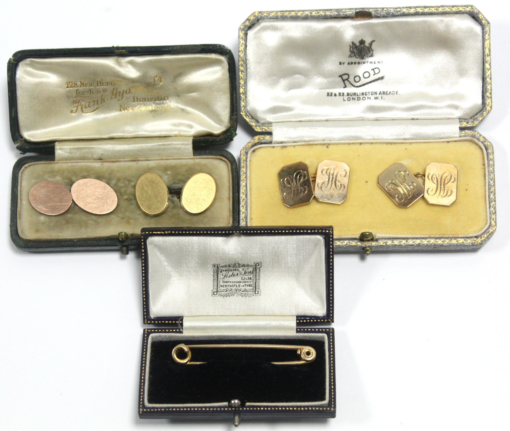 A pair of 9ct. gold cuff-links, the oblong panels with canted corners, London 1939 (12gm); a