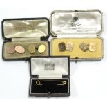A pair of 9ct. gold cuff-links, the oblong panels with canted corners, London 1939 (12gm); a