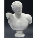A sculptured white marble classical male bust on round socle; 12½” high.