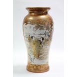 A 19th century Kutani porcelain vase of slender baluster form, finely painted with geisha girls in a