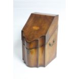 A late 18th century mahogany knife box with sloping hinged lid & serpentine front, brass side