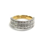 A 22ct. GOLD & DIAMOND HALF-HOOP RING set twenty-two brilliant-cut stones in two rows. (Size R/S;