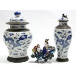 A 19th century Chinese porcelain crackleware baluster vase & cover, painted in blue with dragons,