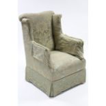 A 19th century wing-back armchair upholstered green floral silk damask, on square tapered legs