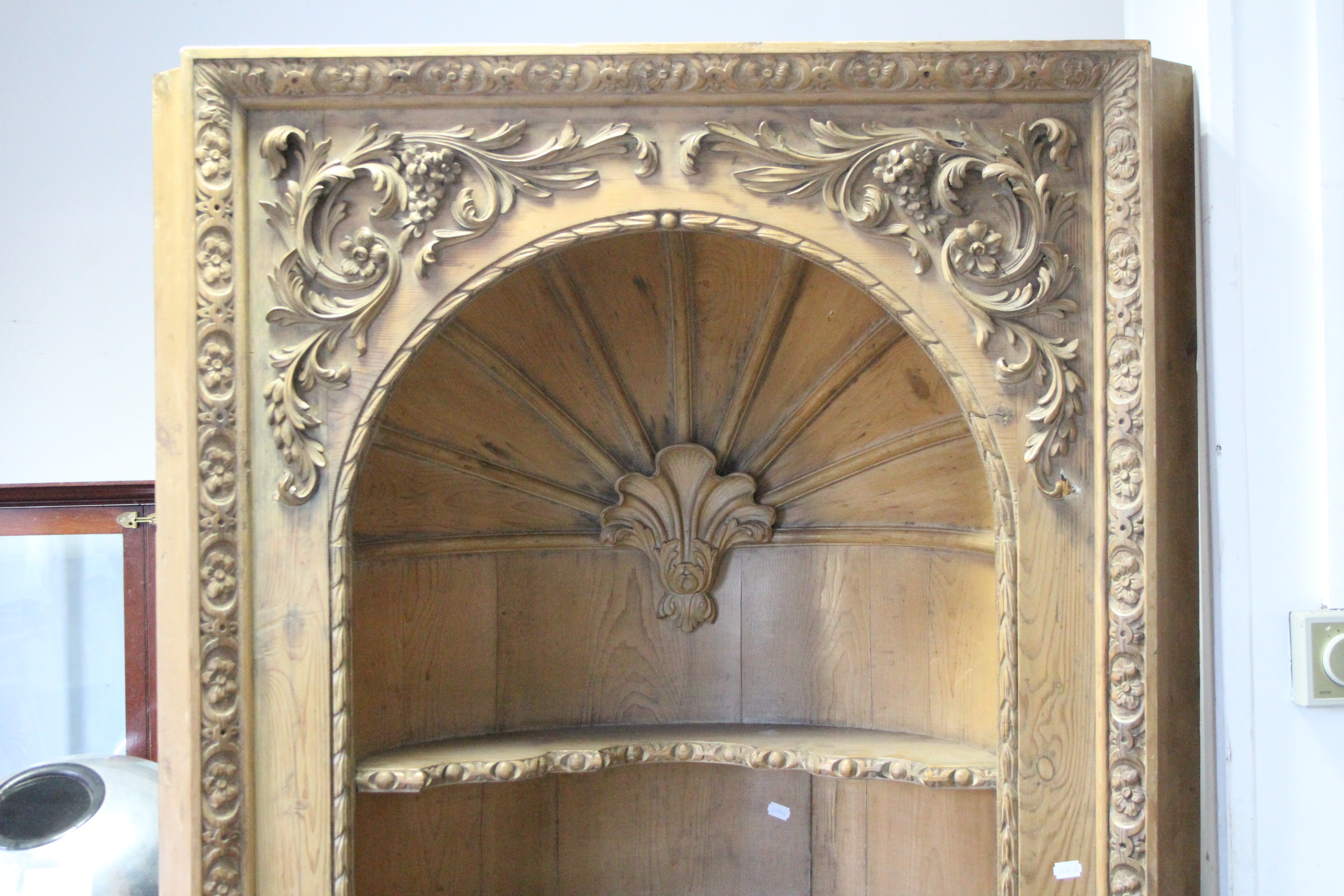 An 18th century pine alcove cabinet, the upper part with barrel-back centred by a shell above - Image 2 of 4
