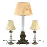 An Edwardian table lamp on opaque glass centre column & brass foliate triform base, with shade;
