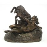 GAREAUD, J. A bronze group of a nude female figure reclining on an animal skin, a goat & kid