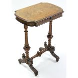 A mid-Victorian burr-walnut work table, the shaped rectangular top fitted frieze drawer, on fluted