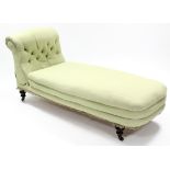 A Victorian day-bed by Shoolbred & Co., upholstered pale-green fabric, & with reclining buttoned-