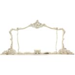 A large rococo style overmantel mirror with arched top, inset three shaped plates, in carved wood