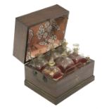 An early 19th century mahogany rectangular decanter box with hinged lid, fitted six square gilt-