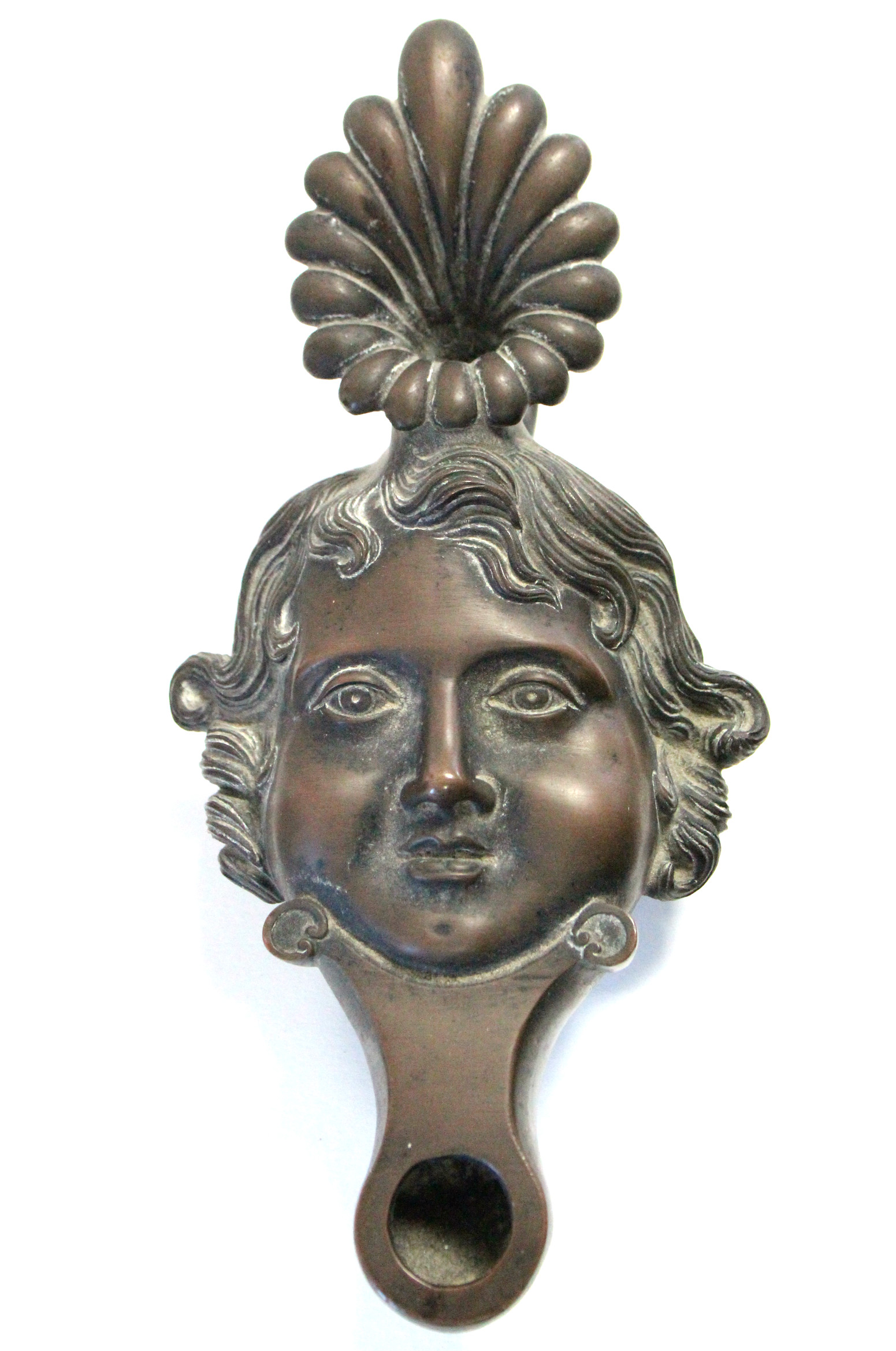 A 19th century Italian Grand Tour renaissance-style oil lamp in the form of a human face, 7¾” wide;