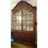 A LATE 18th century DUTCH OAK TALL DISPLAY CABINET, the domed cornice & pair of glazed doors with