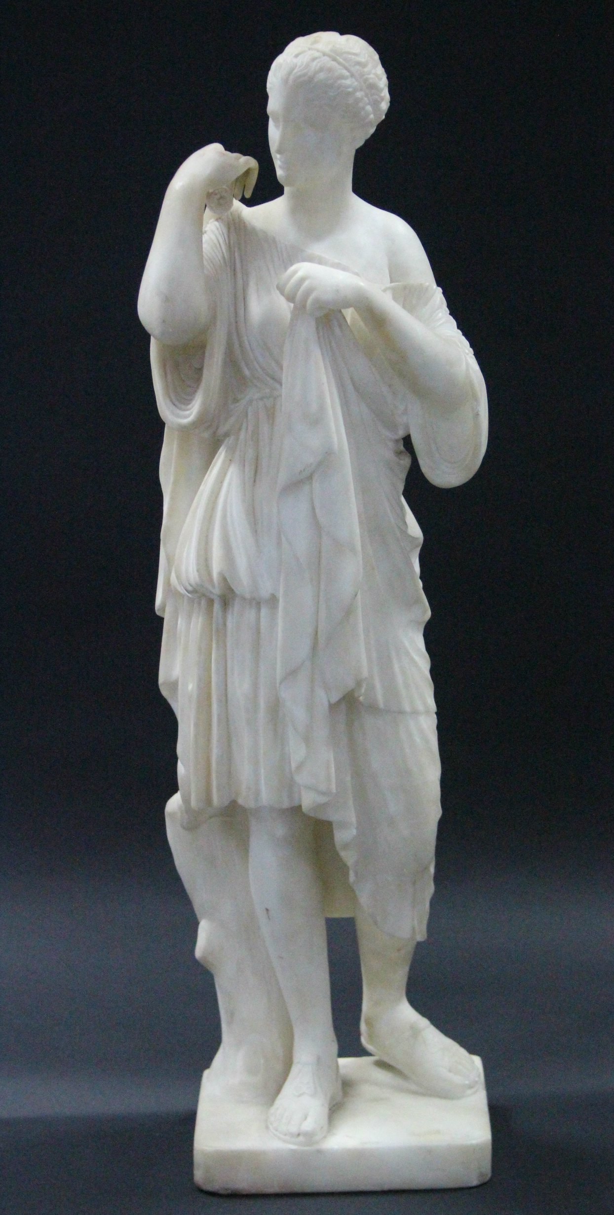A 19th century WHITE MARBLE SCULPTURE OF DIANA OF GABII, after the antique, on flat square base;