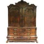 A LATE 18th century DUTCH FIGURED WALNUT PRESS CUPBOARD, the moulded & arched cornice centred by a