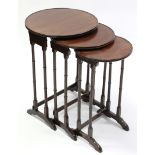 An Edwardian inlaid-mahogany nest of three circular occasional tables on slender turned supports;