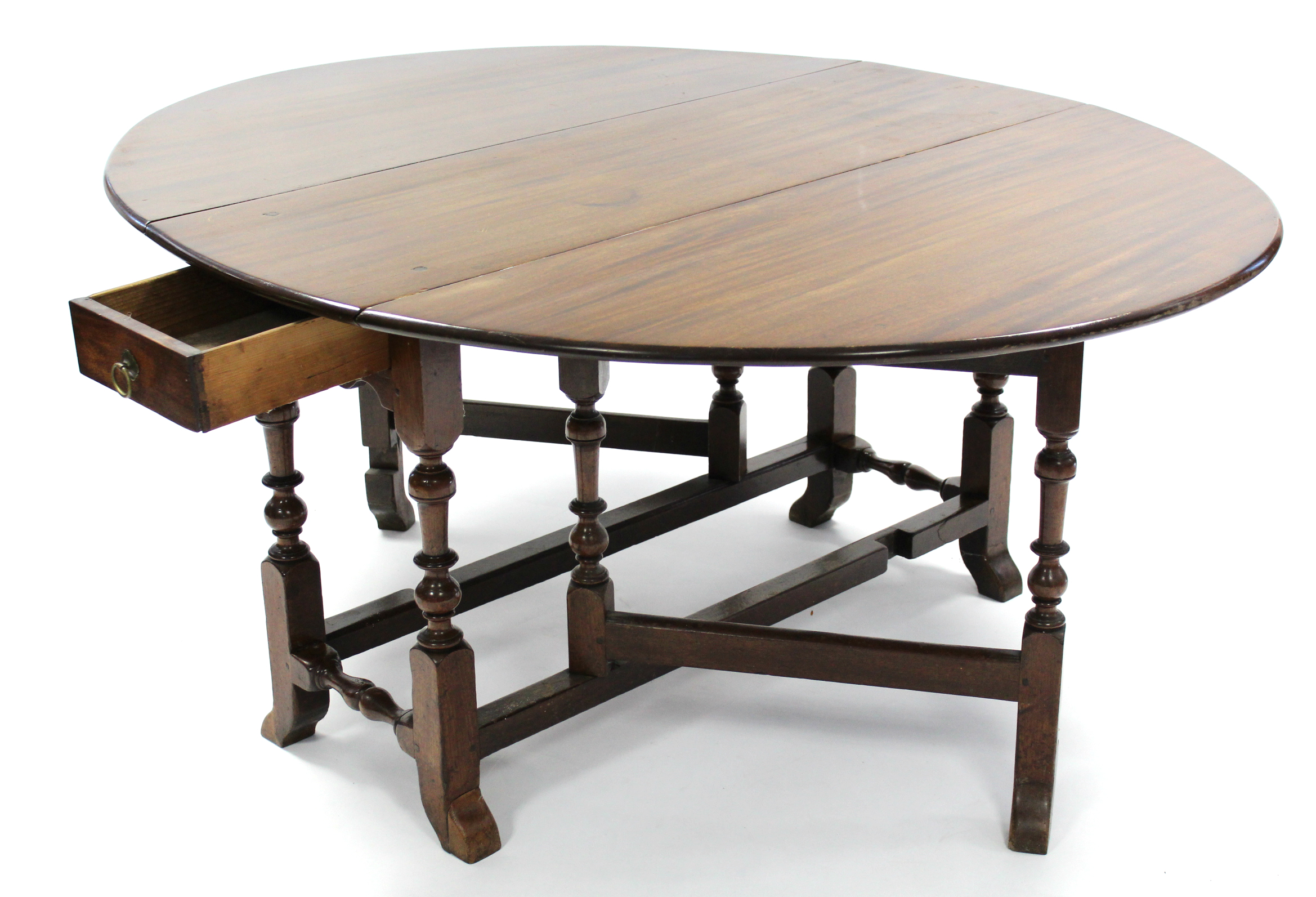 An early 18th century-style mahogany oval gate-leg dining table fitted single drawer to one end, 63"