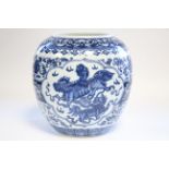 A Chinese blue-&-white porcelain vase of rounded form, painted with panels of lion-dogs within