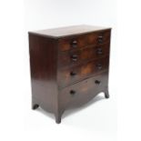 An early 19th century mahogany chest, the rectangular top with boxwood stringing & reeded edge,