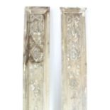 A pair of Georgian style painted door jambs with applied gesso petrae, ribbons, & pendant flowers